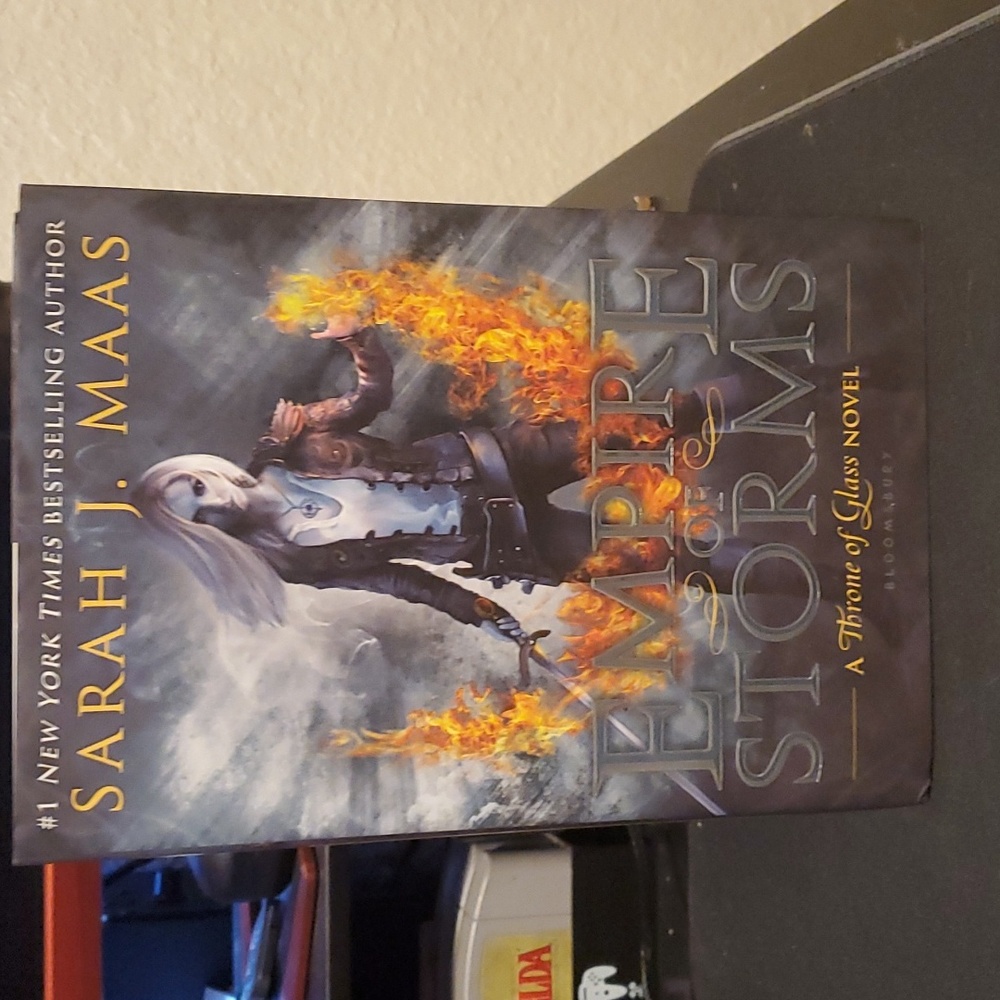 Used Copy of Empire of Storms by Sarah J Maas.